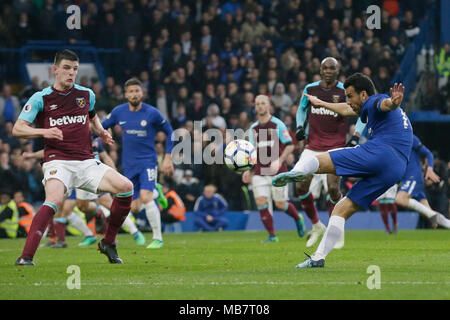 London, UK. 8th Apr, 2018. Chelsea's Pedro (1st R) shoots during the Premier League football match between Chelsea and West Ham United at Stamford Bridge Stadium in London, Britain on April 8, 2018. The match ended with a draw 1-1. Credit: Tim Ireland/Xinhua/Alamy Live News Stock Photo