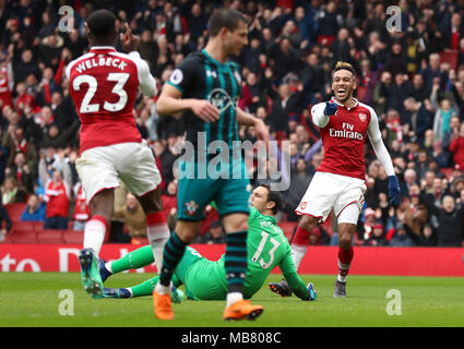 Arsenal's Pierre-Emerick Aubameyang (right) celebrates scoring his side's first goal of the game during the Premier League match at the Emirates Stadium, London. Stock Photo