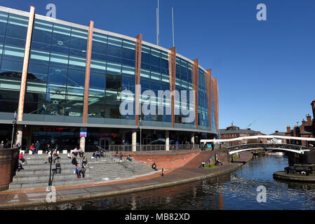 The NIA or National Indoor Arena and canals alongside Brindleyplace, Birmingham, West Midlands, England, UK Stock Photo