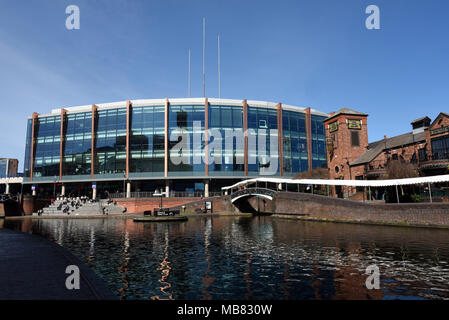 The NIA or National Indoor Arena and canals alongside Brindleyplace, Birmingham, West Midlands, England, UK Stock Photo