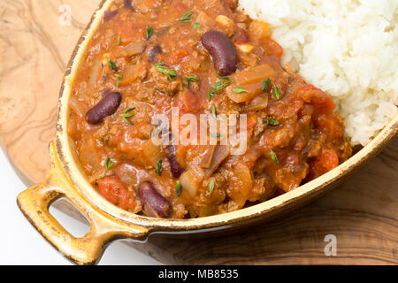Chili con carne made from minced venison from a roe deer, Capreolus capreolus, kidney beans, tomatoes, onions, spices and sprinkled with fresh thyme.  Stock Photo