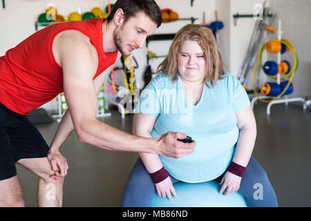Obese Woman Doing Fitness Exercise Stock Photo