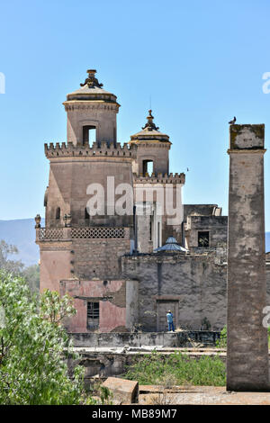 View of the front towers of the Hacienda de Jaral de Berrio from the old Mescal distillery in Jaral de Berrios, Guanajuato, Mexico. The abandoned Jaral de Berrio hacienda was once the largest in Mexico and housed over 6,000 people on the property. Stock Photo