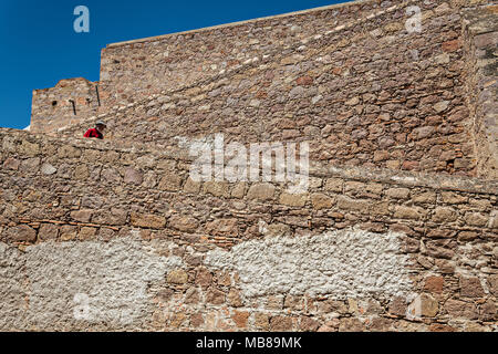 A man walks down the ramp at the old Mescal distillery part of the ruins at the Hacienda de Jaral de Berrio in Jaral de Berrios, Guanajuato, Mexico. The abandoned Jaral de Berrio hacienda was once the largest in Mexico and housed over 6,000 people on the property. Stock Photo