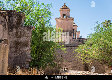 View of the front towers of the Hacienda de Jaral de Berrio from the old Mescal distillery in Jaral de Berrios, Guanajuato, Mexico. The abandoned Jaral de Berrio hacienda was once the largest in Mexico and housed over 6,000 people on the property. Stock Photo