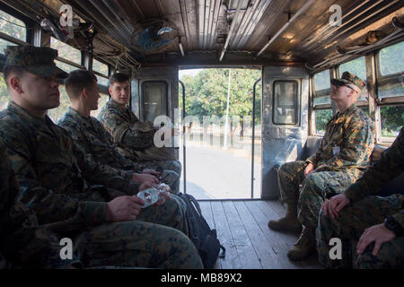 Marines from Marine Aircraft Group 12 and Marine Fighter Attack Squadron 251 ride in a transportation truck at Korat Air Force Base, Kingdom of Thailand, Feb. 8, 2018. These units, from Marine Corps Air Station Iwakuni, Japan, are scheduled to work alongside the Royal Thai Air Force during the 37th iteration of Exercise Cobra Gold with the purpose of increasing the interoperability between allied nations, who have a long-standing alliance and commitment to security in the Indo-Pacific region. Cobra Gold 18 is an annual exercise conducted within the Kingdom of Thailand held from Feb. 13-23 with Stock Photo