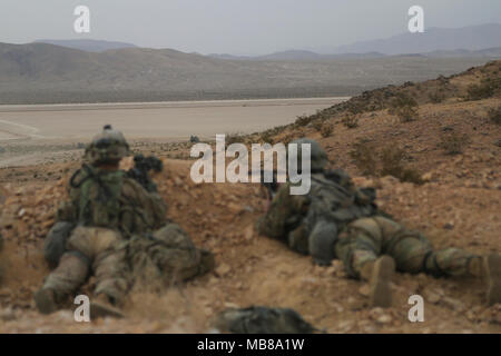 U.S. Soldiers assigned to 2nd Platoon “Bandit Troop”, 1st Squadron, 3rd Cavalry Regiment, scan for simulated enemies at an observation post during Decisive Action Rotation 18-04 at the National Training Center in Fort Irwin, Calif., Feb. 10, 2018. Decisive Action Training Exercises at the National Training Center ensure units remain versatile, responsive, and consistently available for current and future contingencies. (U.S. Army Stock Photo