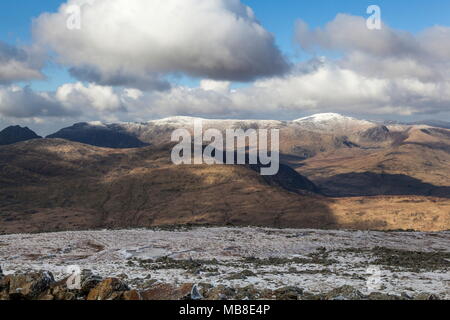 A view of the snow capped Carneddau mountain range in Snowdonia viewed from the summit of Moel Siabod Stock Photo