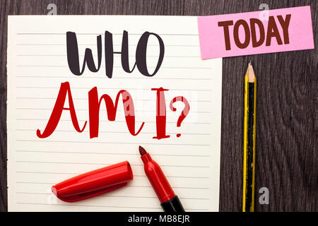 Writing note showing  Who Am I Question. Business photo showcasing Question Asked Identity Thinking Doubt Psycology Mystery written on Notebook Paper on the Wooden background Today Marker Pencil. Stock Photo