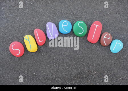 Sylvester, masculine name with multicolored stones over natural volcanic black sand Stock Photo