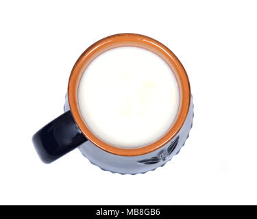 Cream top organic whole milk in ceramic cup isolated on white background Stock Photo