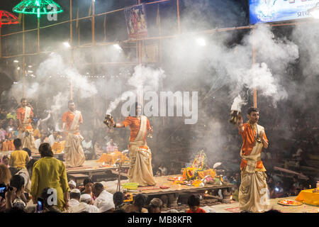 Men perform the nightly Hindu Puja Rituals in Varanasi, Uttar Pradesh, India Stock Photo