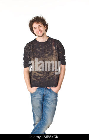 Nice smiling man pointing hands in pockets and posing to camera Stock Photo