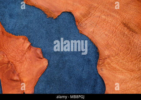 Close up orange rough edge and navy blue leather divide in two section, fashion texture background,fabric division. Stock Photo