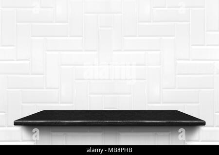 Empty black marble shelf at white ceramic tile wall pattern background,Mock up for display or montage of product or design Stock Photo