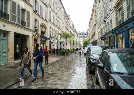 Walking in the streets of Paris in May. The light drizzle couldn'tt spoil the mood... Stock Photo
