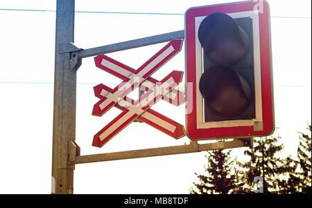 Close up of train level crossing light and sign Stock Photo