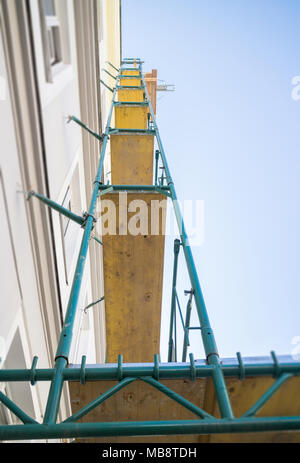 Construction site, renovating scaffold on old apartment building in europe Stock Photo