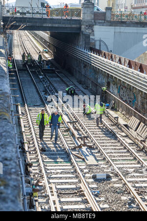 Railroad workers in metro channel working on renovation, Vienna Austria 2-04-2018 Stock Photo