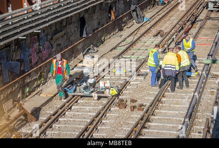 Railroad workers in metro channel working on renovation, Vienna Austria 2-04-2018 Stock Photo