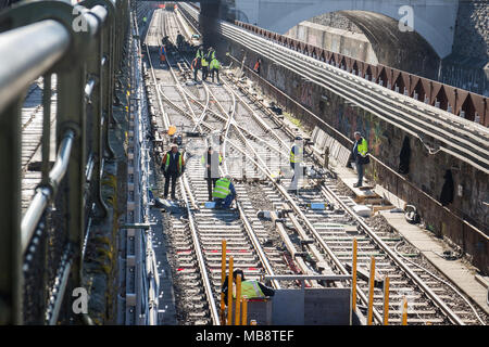 Railroad workers in metro channel working on renovation, Vienna Austria 2-04-2018 Stock Photo