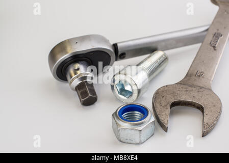 Torque wrench, spanners and nuts on white background Stock Photo