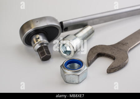 Torque wrench, spanners and nuts on white background Stock Photo