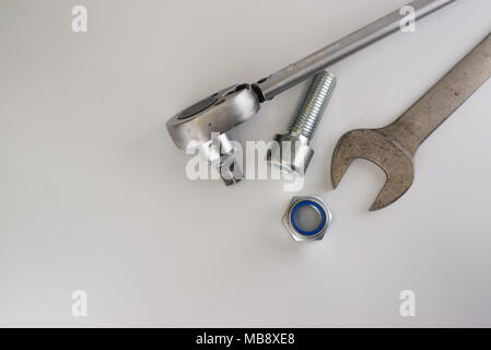 Torque wrench, spanners and nuts on white background Stock Photo