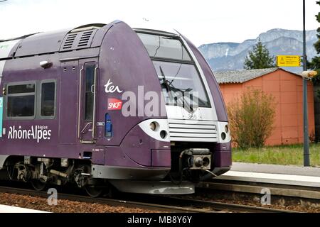 Waiting for the TER train along the dock, Grenoble SNCF station, Auvergne Rhone-Alpes region, and logo of the SNCF, National Railway Company. Grenoble Stock Photo