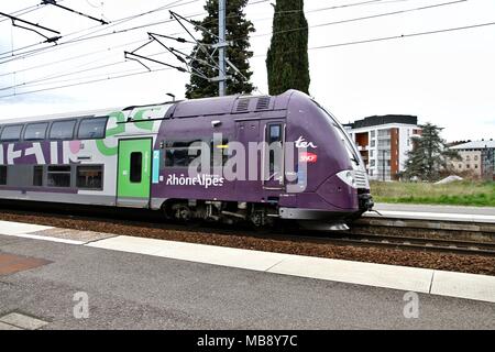 Waiting for the TER train along the dock, Grenoble SNCF station, Auvergne Rhone-Alpes region, and logo of the SNCF, National Railway Company. Grenoble Stock Photo