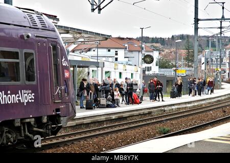 Waiting for the TER train along the dock, Grenoble SNCF station, Auvergne Rhone-Alpes region, and logo of the SNCF, National Railway Company. Grenoble Stock Photo