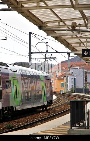 Waiting for the TER train along the dock, Grenoble SNCF station, Auvergne Rhone-Alpes region, and logo of the SNCF, National Railway Company. Grenoble Stock Photo