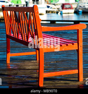 Close Up Of A Red Wooden Seat Or Bench On A Quayside In Sandnes Norway Stock Photo