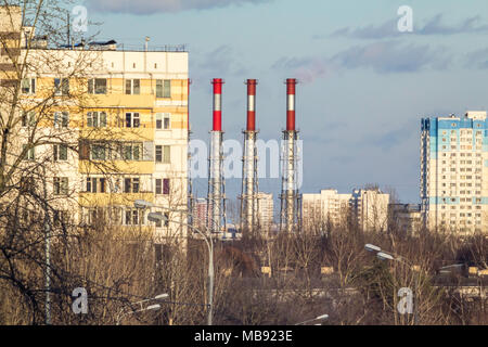 View of the sleeping area of Moscow in the spring. Multi-storey houses on a blue sky background. Stock Photo