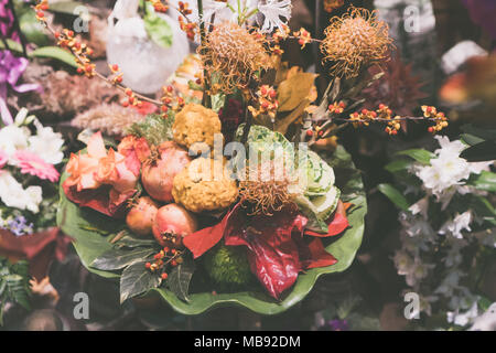 Vintage looking image of artificial flowers in a bouquet for house decoration Stock Photo