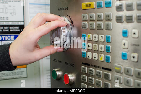 Buttons, hands and inscription on cnc machine tool. Stock Photo
