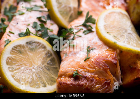 salmon baked in oven with lemon macro Stock Photo