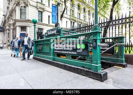 New York City, USA - October 30, 2017: Broadway St by Wall Street, people in NYC Manhattan lower financial district downtown by subway station entranc Stock Photo