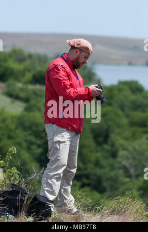 Male photographer at work Stock Photo