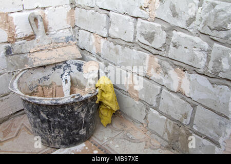 Construction tools on concrete background. Copy space for text. Set of assorted plaster trowel tools and spatula . Top view Stock Photo