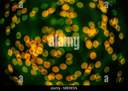 Bokeh background glowing oval shaped glow yellow and dark green empty Stock Photo