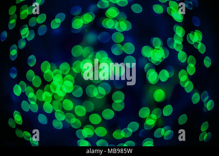 Bokeh background glowing oval shaped glow bright green and blue empty Stock Photo