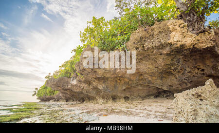 Beautiful gentle nature of the Philippines. The island of Bohol. A beach with sloping cliffs. Anda. Poblacion village. Stock Photo