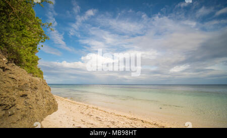 Beautiful gentle nature of the Philippines. The island of Bohol. A beach with sloping cliffs. Anda. Poblacion village. Stock Photo