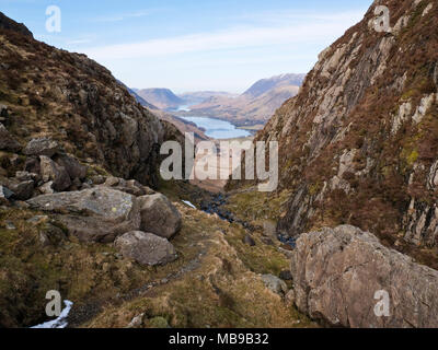 View down the ravine of Black Beck, under the crags of Haystacks to Warnscale Bottom and Buttermere, with Crummock Water & Mellbreak beyond. Stock Photo