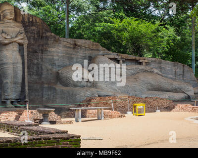 The ancient reclining Buddha image and the standing Buddha image at Gal Vihara, Polonnaruwa, Sri Lanka Stock Photo