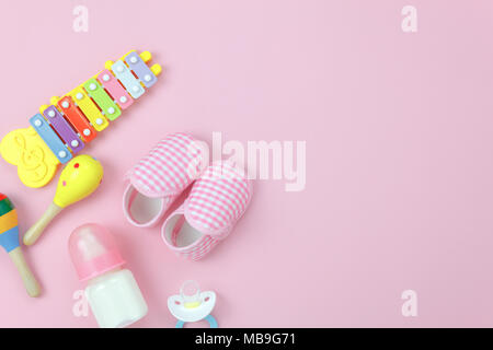 Table top view image the kids toys for development background concept.Flat lay accessory objects for children on modern rustic pink at home office des Stock Photo