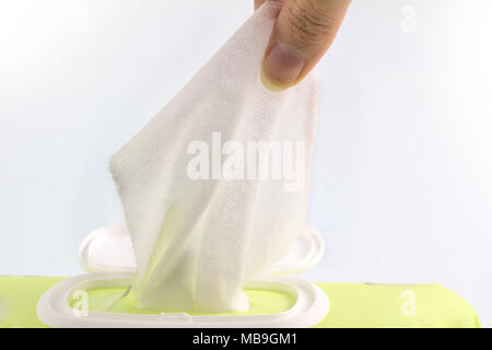 Hand picked a baby wet wipes in package box isolated white background, with clipping path. Stock Photo