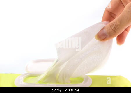 Hand picked a wet wipes in package box isolated white background,  Wet wipes in a woman's hand, with clipping path. Stock Photo