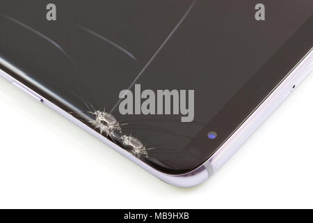 New and modern smartphone with screen has cracks, Touch screen smartphone with broken screen isolated on white background, with clipping path. Stock Photo